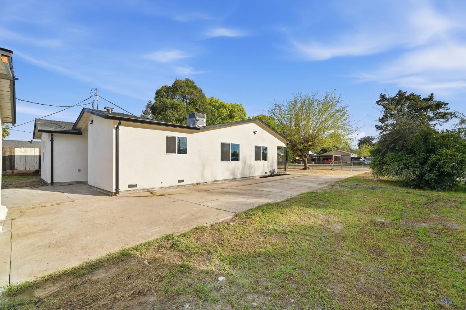 430 Laurel Avenue Modesto, CA 95351 - Photo 5 of 28 a view of a house with backyard and a parking space