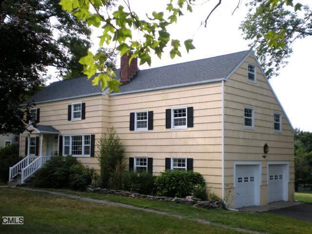 37 Harding Drive Ridgefield, CT 06877 - Photo 1 of 1 a front view of a house with a garden