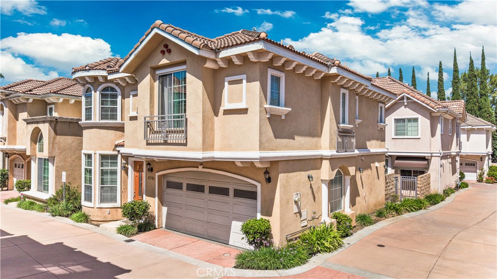 454 West Duarte Road, Unit D Arcadia, CA 91007 - Photo 2 of 27 a front view of a house with a yard and garage