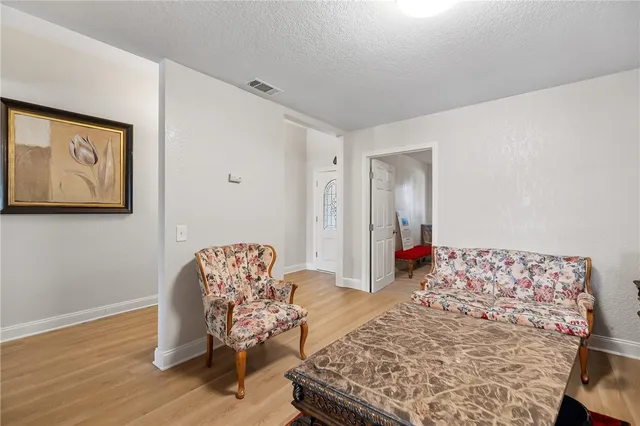 a bedroom with bed and furniture