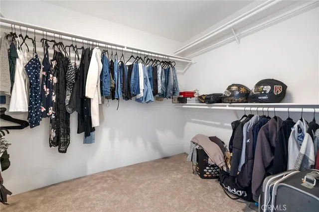 a spacious bathroom with a double vanity sink a mirror and a shower