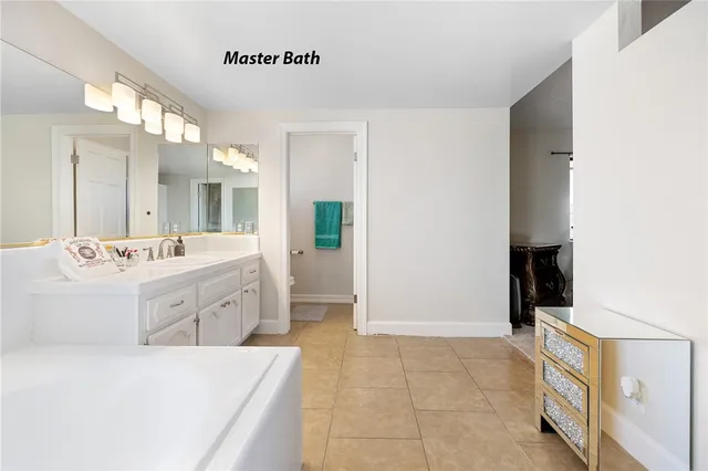 a white toilet sitting next to a shower curtain