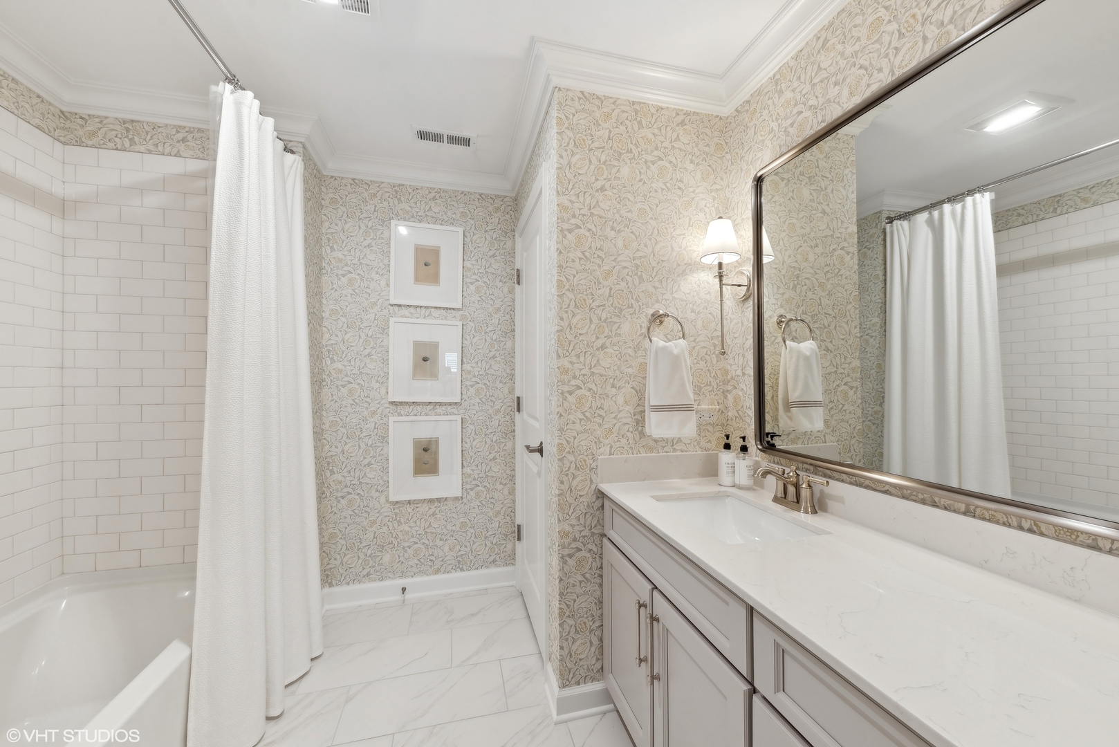 2513 Geranium Way Rolling Meadows, IL 60008 - Photo 16 of 19 a bathroom with a double vanity sink a large mirror and a bathtub