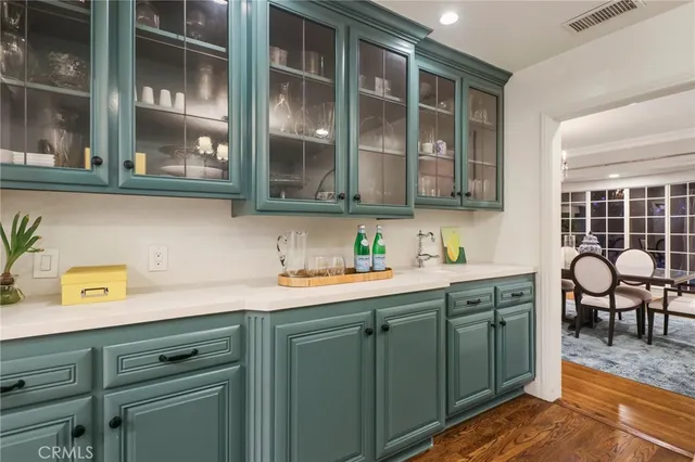 a kitchen with a sink and cabinets