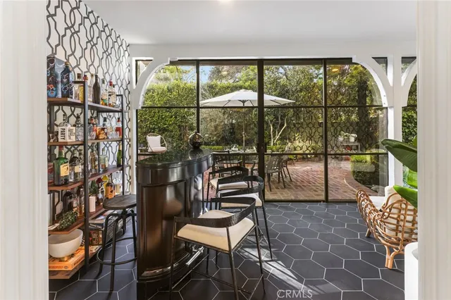 a view of a chairs and table in the patio