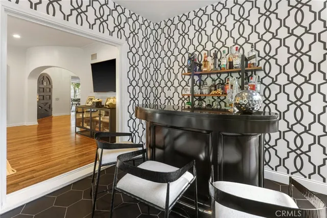 a living room with a couch and wooden floor