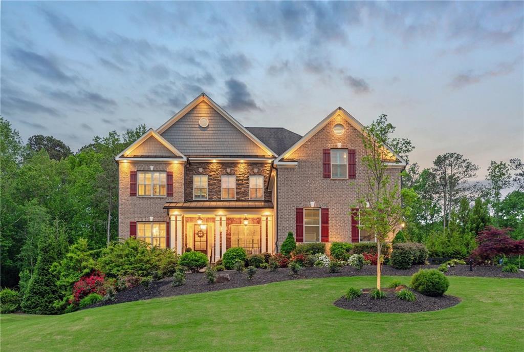a front view of a house with a yard