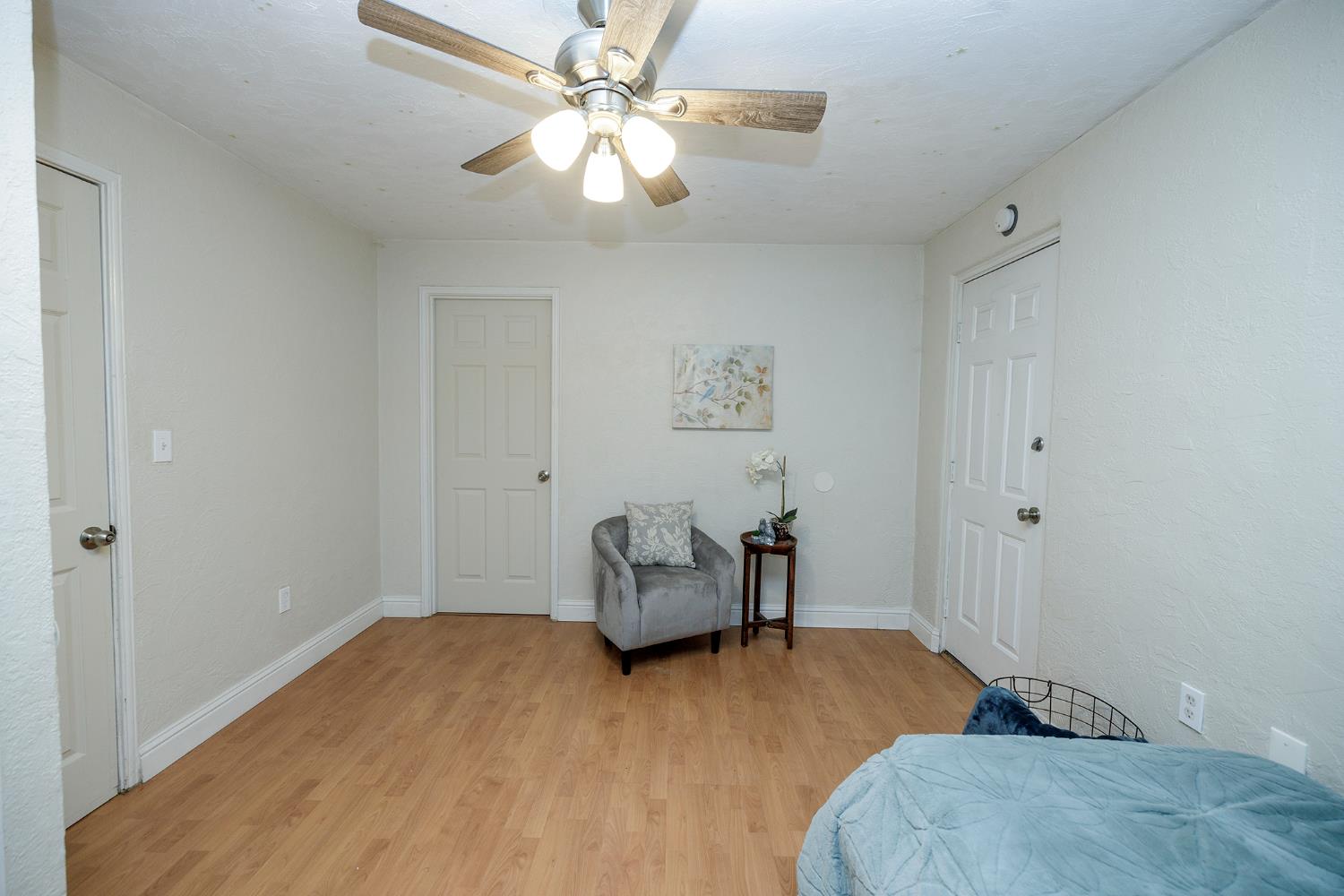 1244 Melrose Avenue Modesto, CA 95350 - Photo 23 of 39 a bedroom with a bed and wooden floor