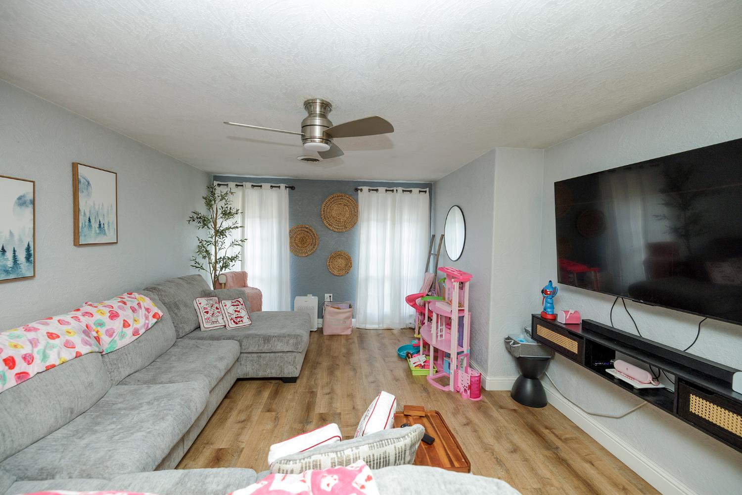 1244 Melrose Avenue Modesto, CA 95350 - Photo 28 of 39 a living room with furniture and a flat screen tv