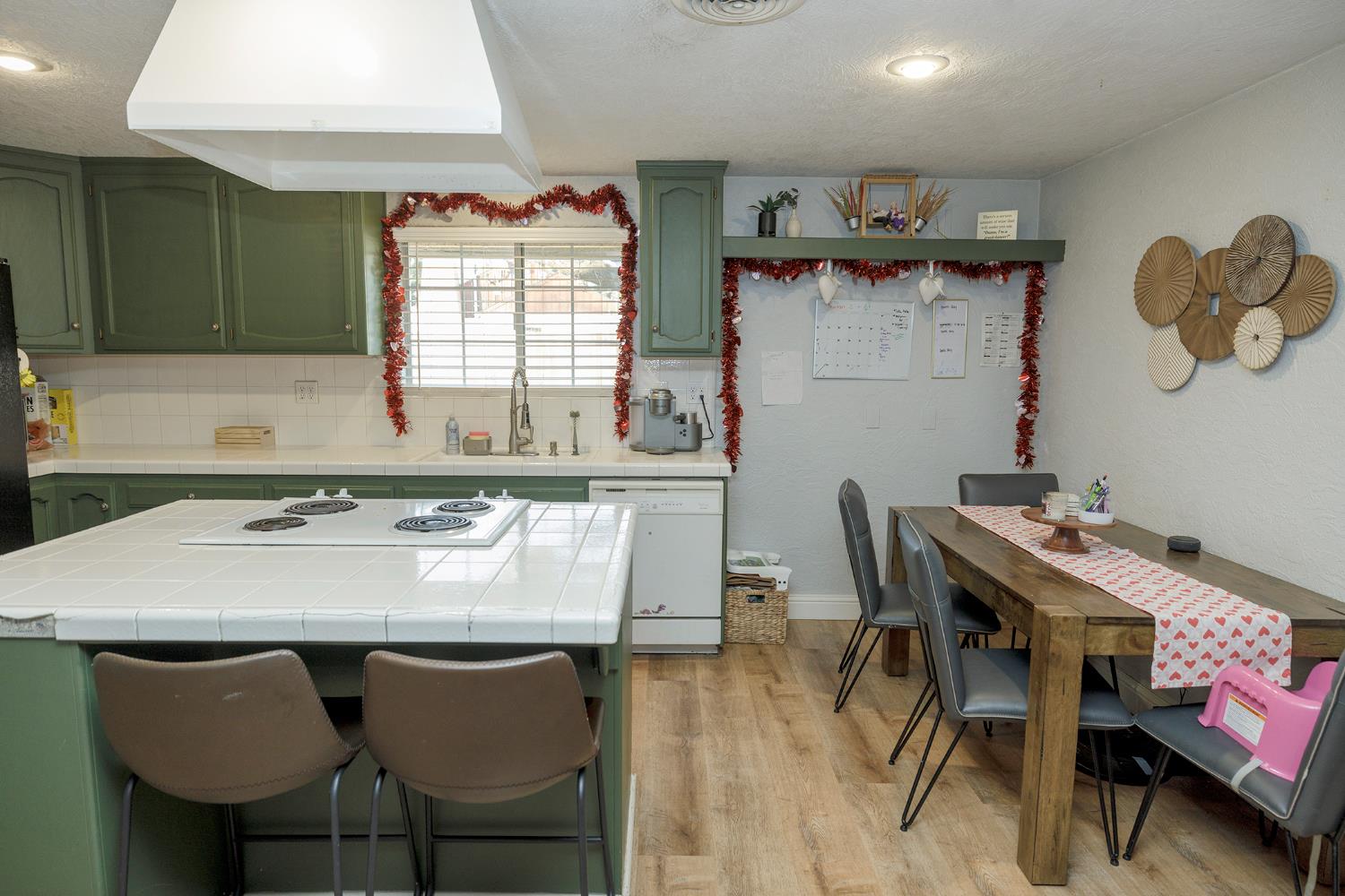 1244 Melrose Avenue Modesto, CA 95350 - Photo 31 of 39 a dining table with chairs and window