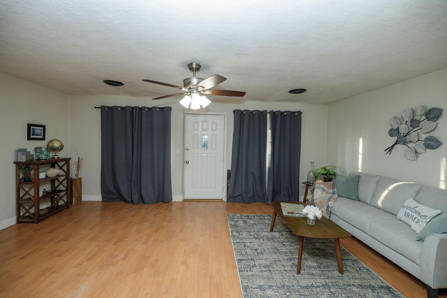 1244 Melrose Avenue Modesto, CA 95350 - Photo 4 of 39 a living room with furniture and a chandelier