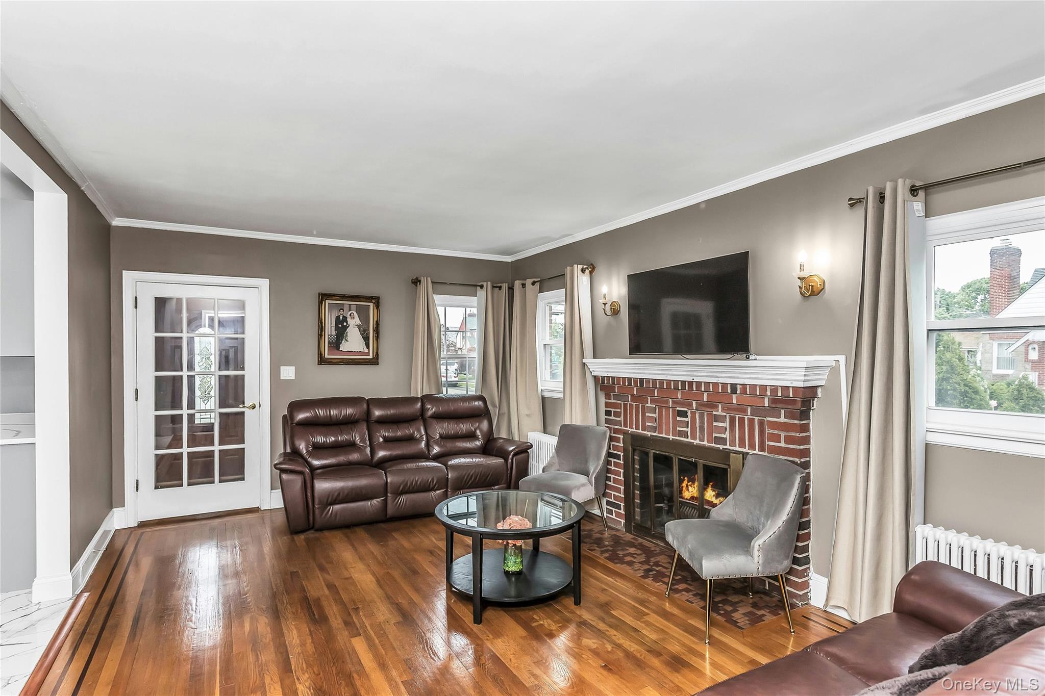 103 Union Street Valley Stream, NY 11580 - Photo 5 of 19 a living room with furniture and a fireplace