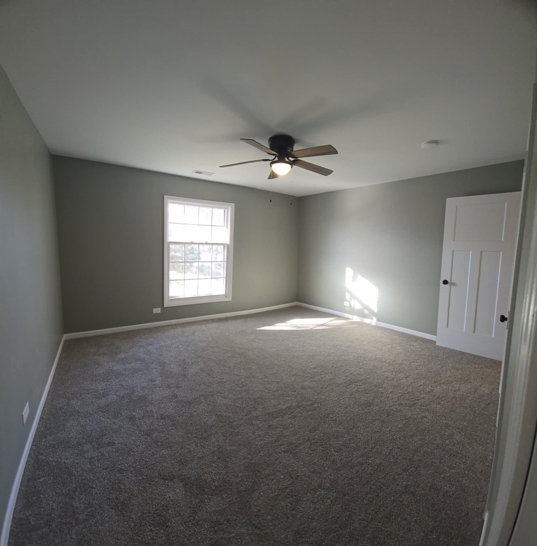 2860 Northampton Drive, Unit B2 Rolling Meadows, IL 60008 - Photo 17 of 22 a view of an empty room with a window
