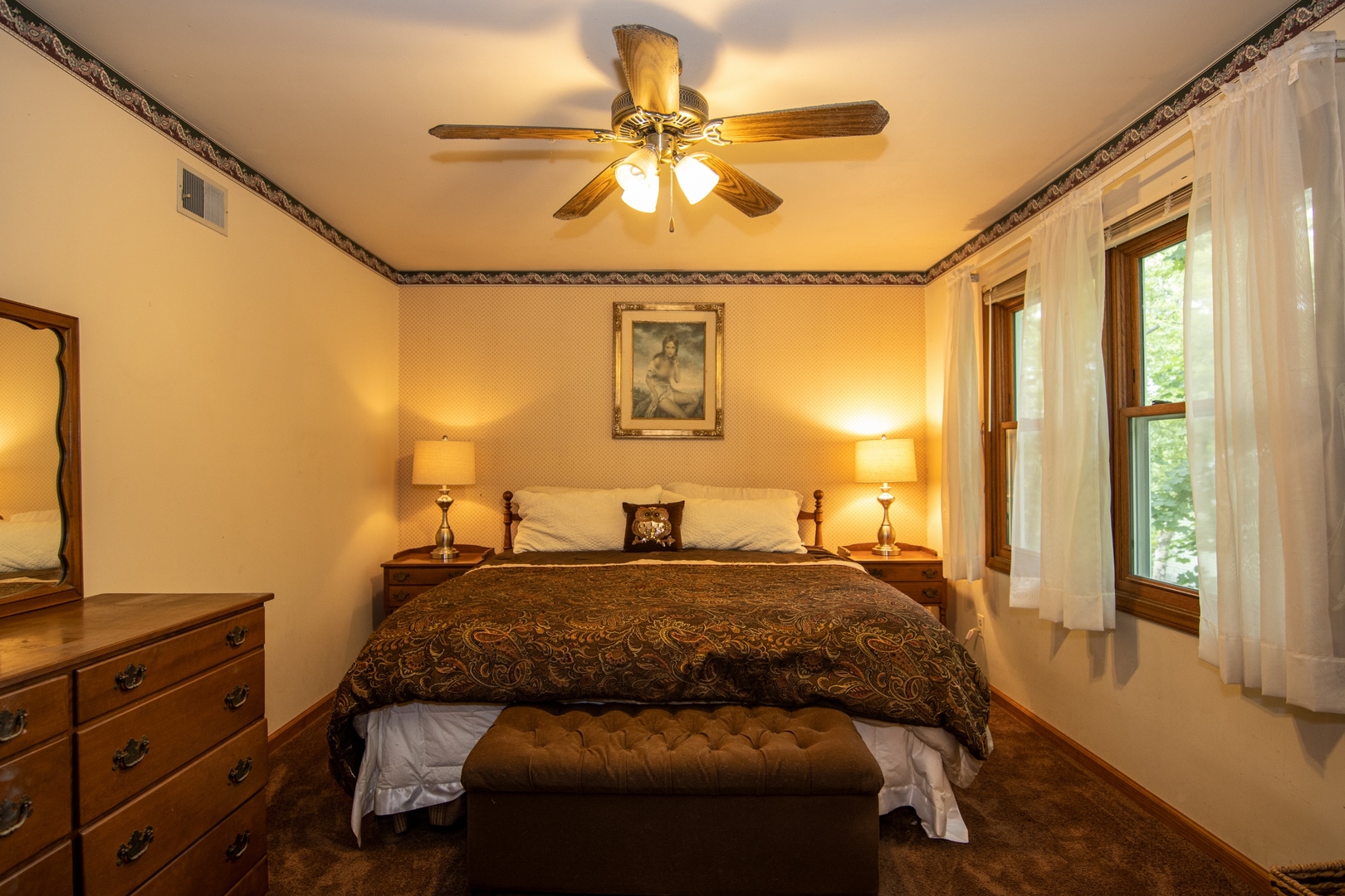 1610 South Tyler Road St. Charles, IL 60174 - Photo 8 of 16 a bedroom with a bed and a chandelier