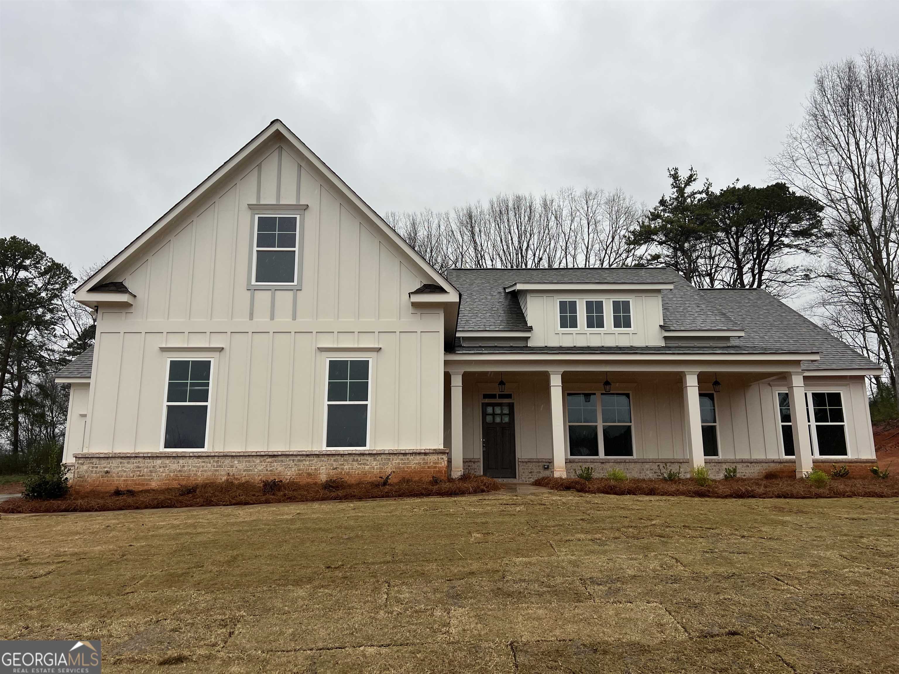874 Smith Mill Road, Unit 10 Winder, GA 30680 - Photo 1 of 1 a front view of a house with a garden