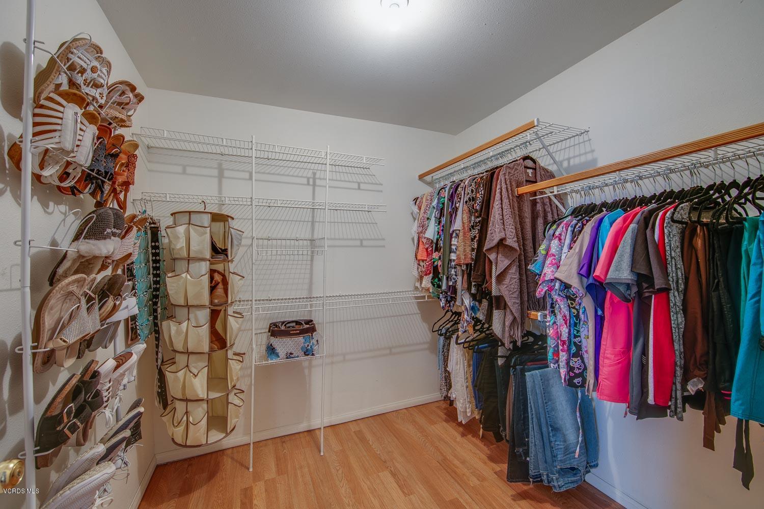 4265 Apricot Road Simi Valley, CA 93063 - Photo 22 of 39 a view of walk in closet with clothes and shoes