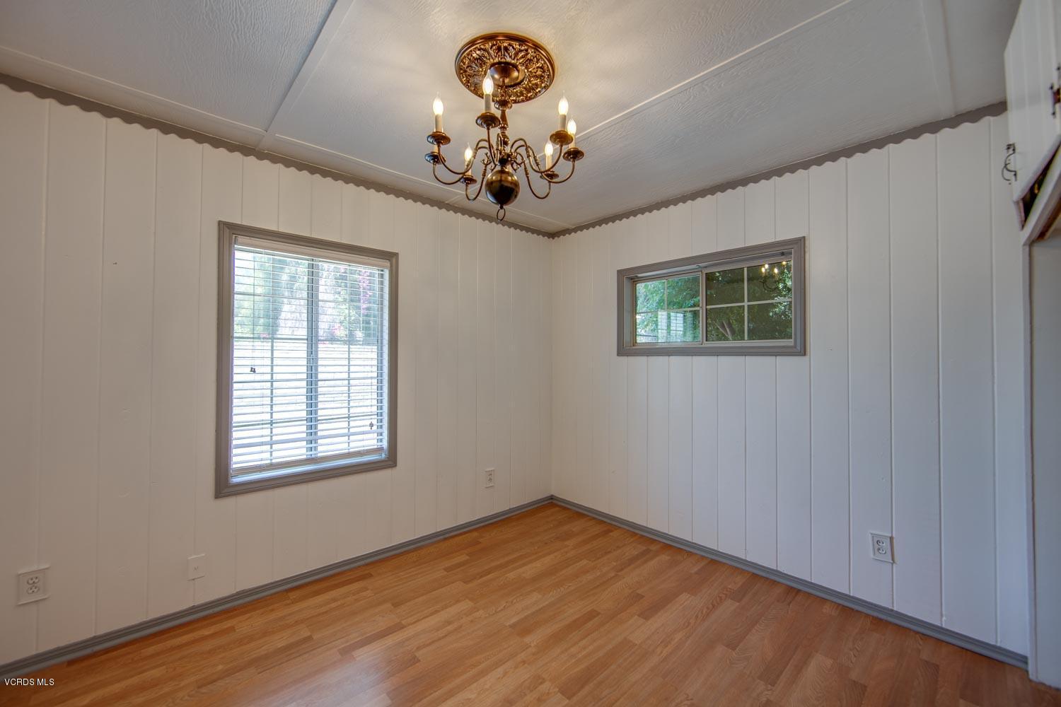 4265 Apricot Road Simi Valley, CA 93063 - Photo 23 of 39 a view of an empty room with a window and wooden floor
