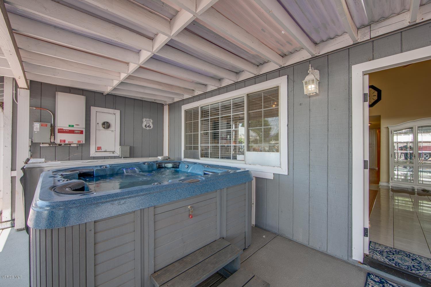 4265 Apricot Road Simi Valley, CA 93063 - Photo 30 of 39 a bathroom with a granite countertop sink and large mirror