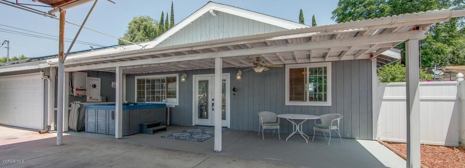 4265 Apricot Road Simi Valley, CA 93063 - Photo 4 of 39 a view of a patio with table and chairs and potted plants