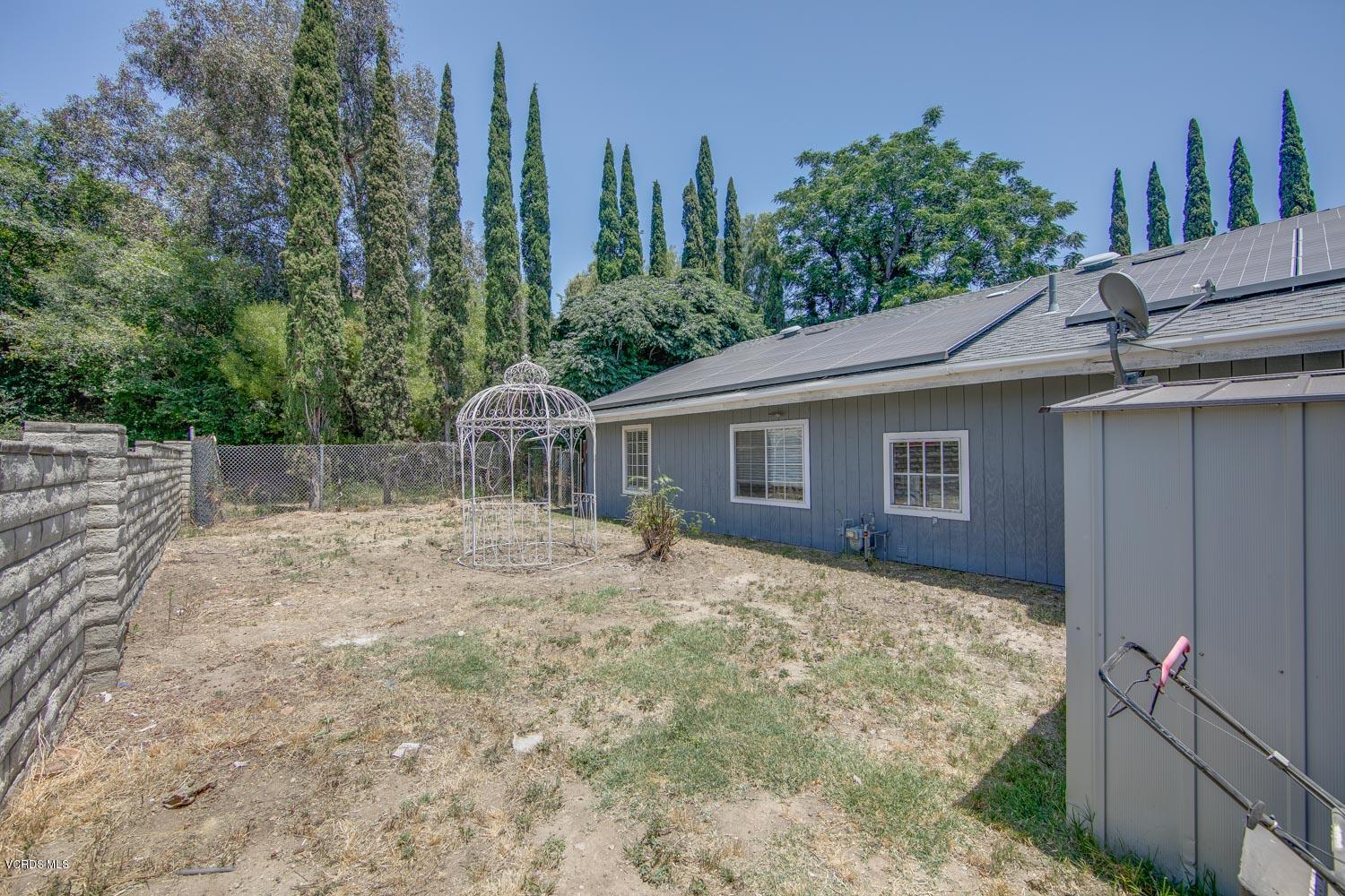 4265 Apricot Road Simi Valley, CA 93063 - Photo 33 of 39 a backyard of a house with table and chairs