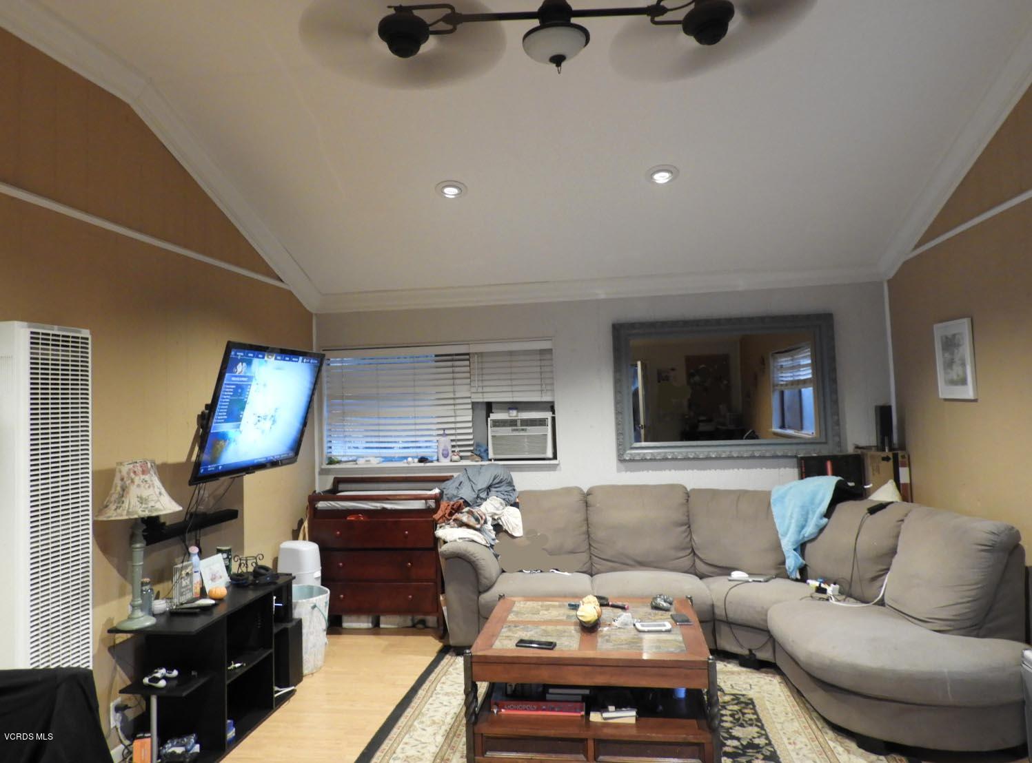 4265 Apricot Road Simi Valley, CA 93063 - Photo 35 of 39 a living room with furniture and a flat screen tv