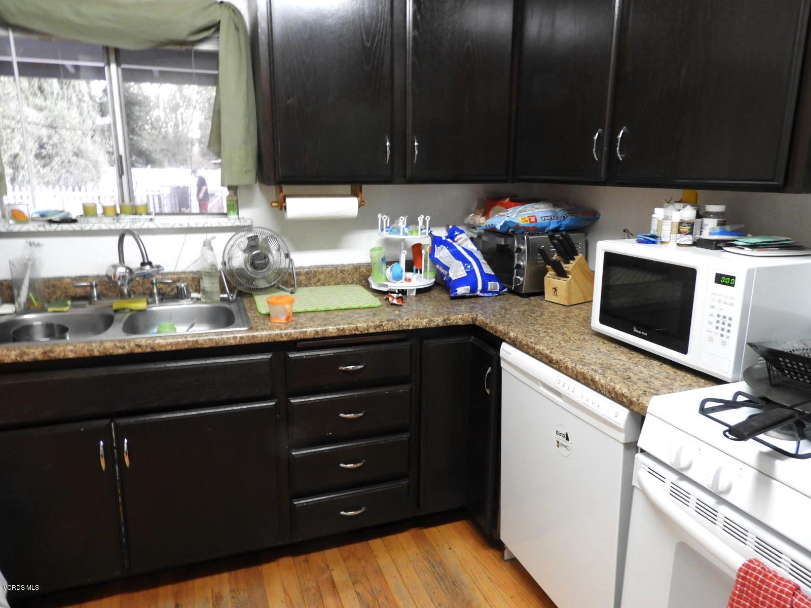 4265 Apricot Road Simi Valley, CA 93063 - Photo 36 of 39 a kitchen with a sink cabinets and a window