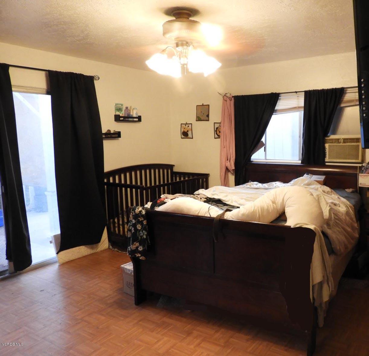 4265 Apricot Road Simi Valley, CA 93063 - Photo 37 of 39 a bed sitting in a bedroom next to a window