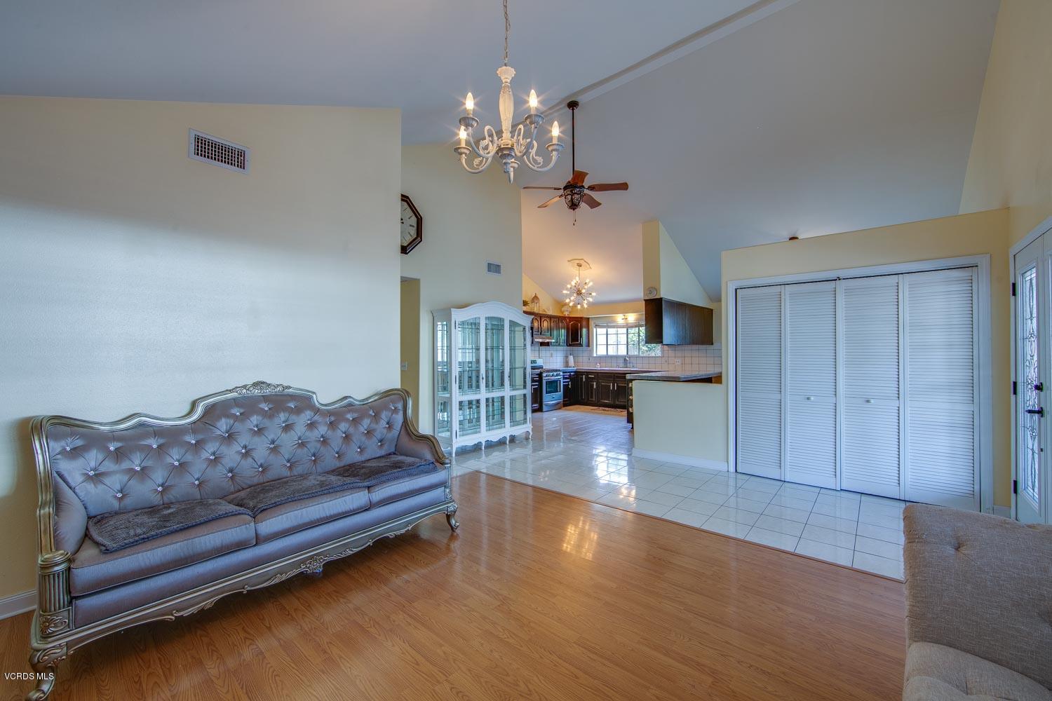 4265 Apricot Road Simi Valley, CA 93063 - Photo 7 of 39 a living room with furniture and a chandelier