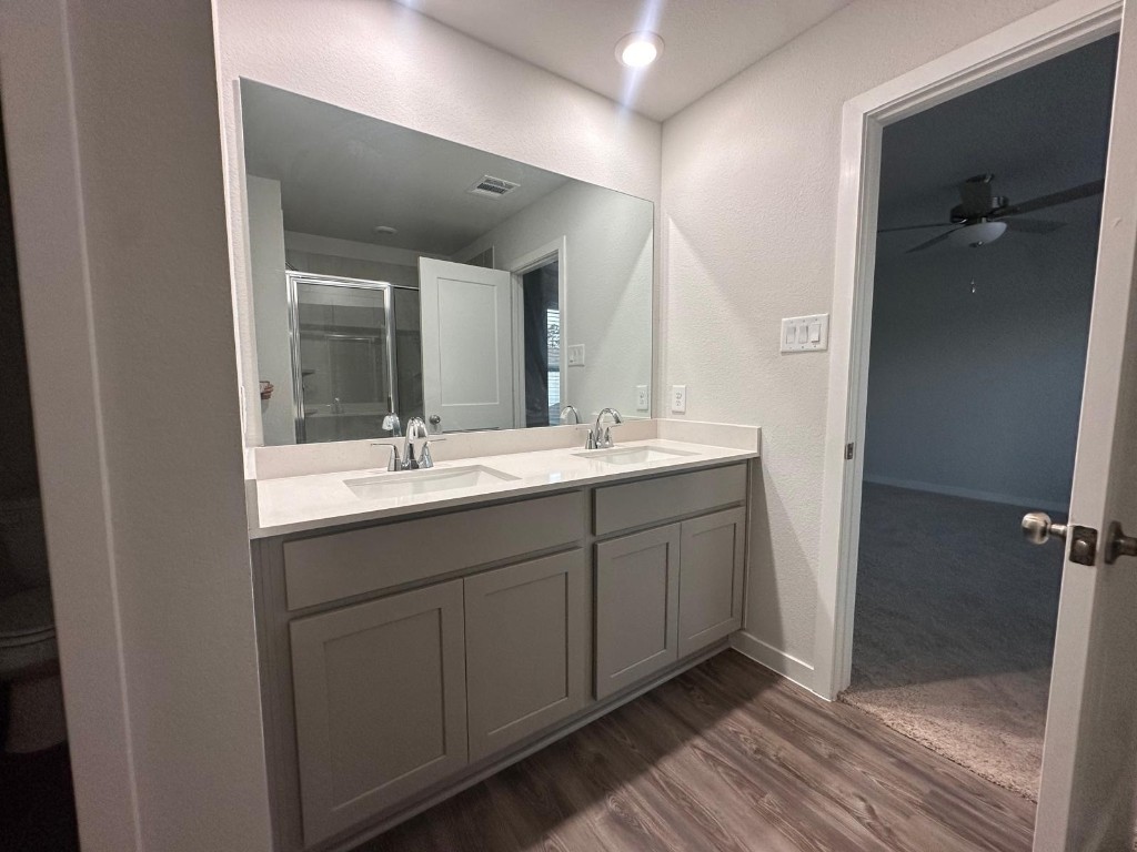 211 Brazen Forest Trail Magnolia, TX 77355 - Photo 2 of 11 a bathroom with a double vanity sink and mirror