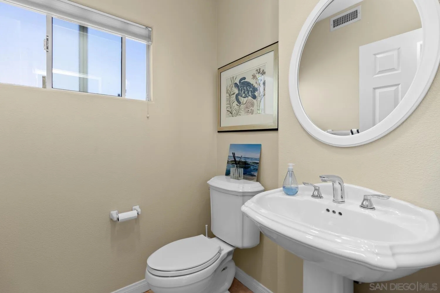 7517 Jerez Court, Unit B Carlsbad, CA 92009 - Photo 19 of 26 a bathroom with a sink and a toilet