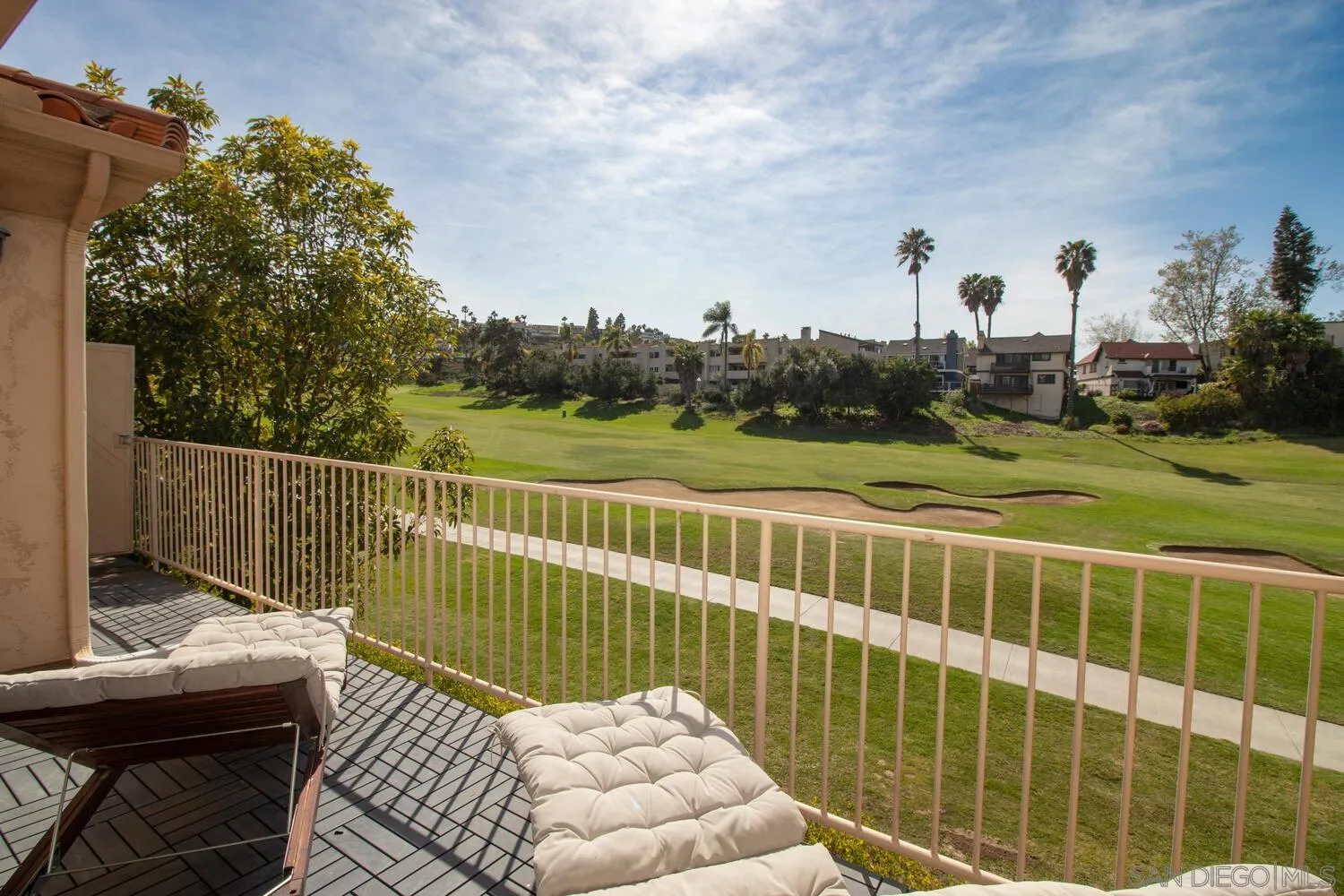 7517 Jerez Court, Unit B Carlsbad, CA 92009 - Photo 2 of 26 a view of a balcony with wooden floor