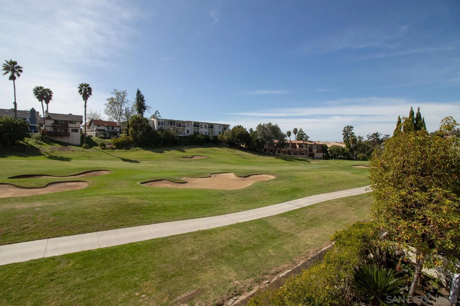 7517 Jerez Court, Unit B Carlsbad, CA 92009 - Photo 22 of 26 a view of a golf course with a park