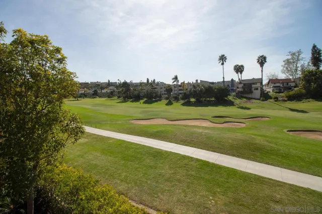 a view of a golf course with a lake