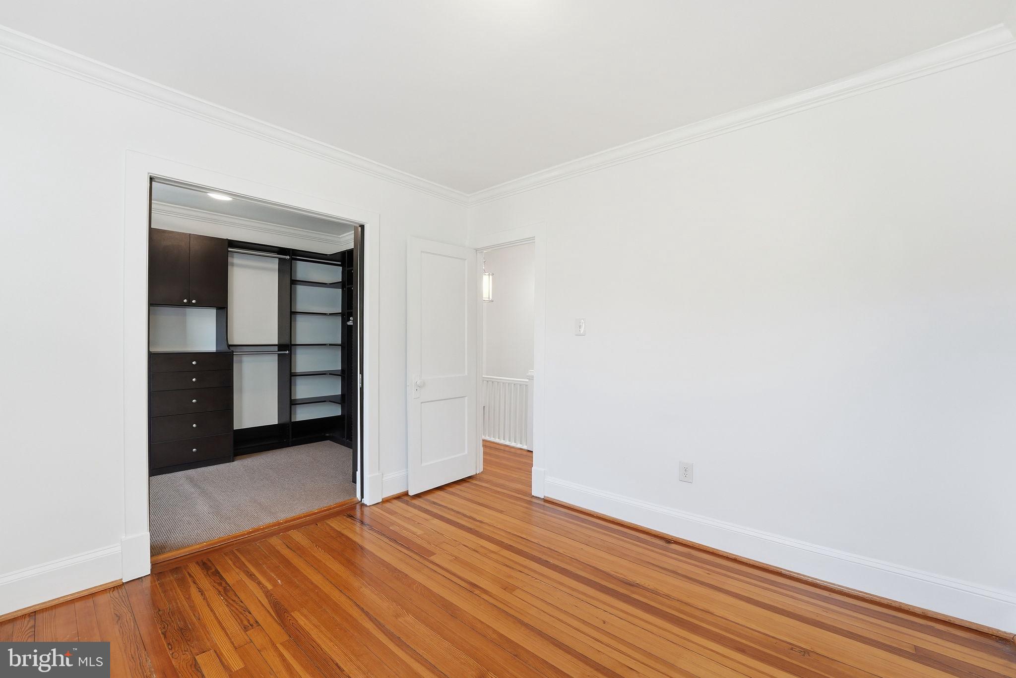 5149 MacArthur Boulevard Northwest Washington, DC 20016 - Photo 12 of 19 a view of a room with wooden floor and closet