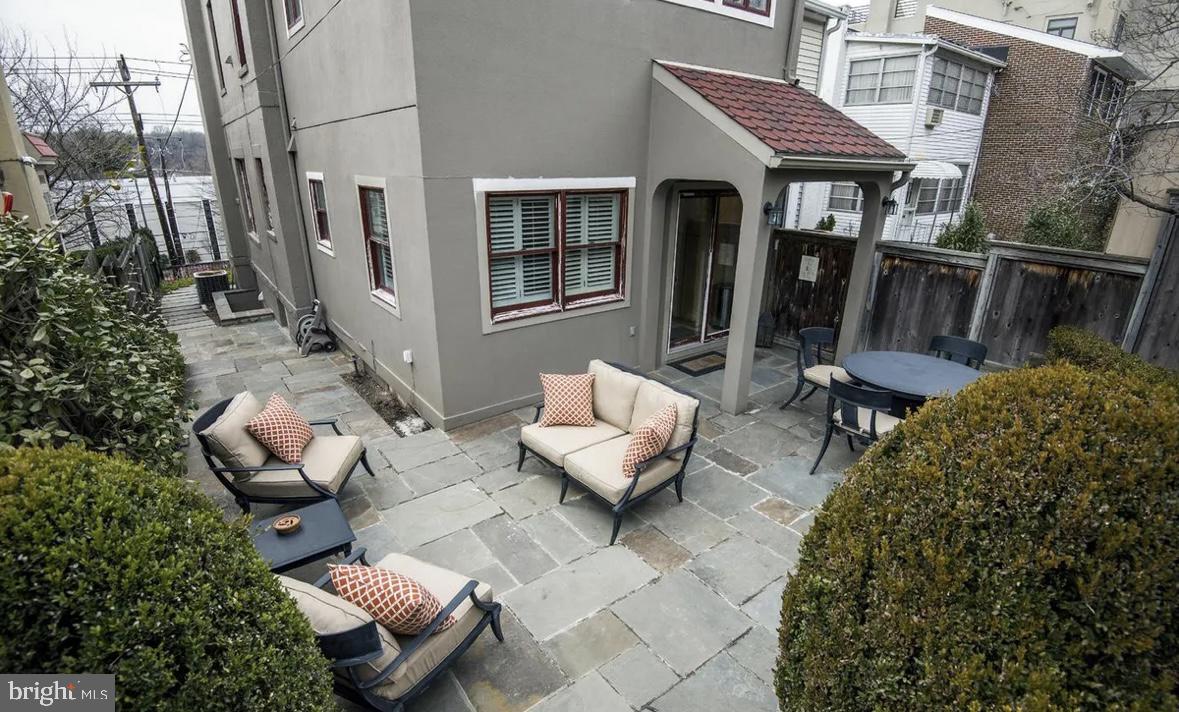 5149 MacArthur Boulevard Northwest Washington, DC 20016 - Photo 19 of 19 a view of a patio with chairs and a potted plant