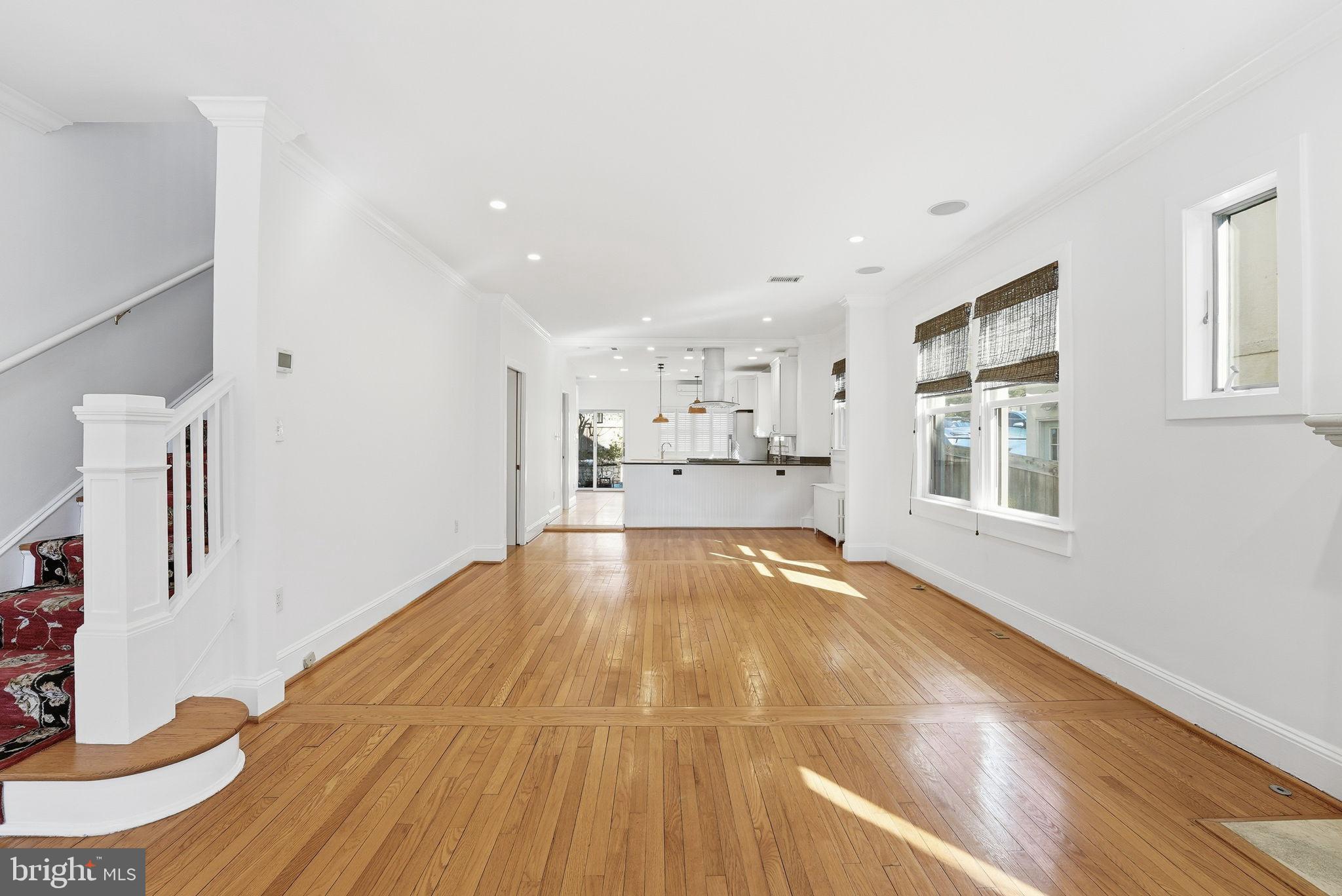 5149 MacArthur Boulevard Northwest Washington, DC 20016 - Photo 4 of 19 a view of empty room with wooden floor and windows
