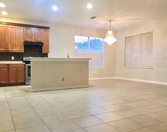 a view of a kitchen with microwave and cabinets