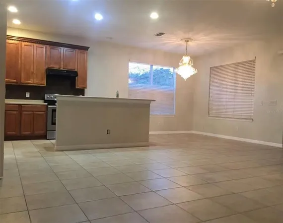 a view of a kitchen with microwave and cabinets