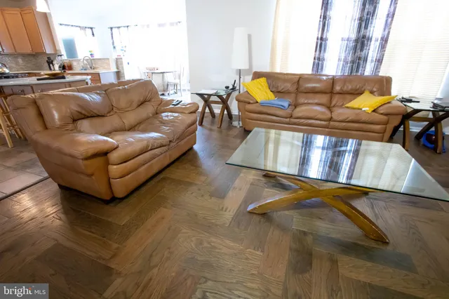 a kitchen with stainless steel appliances granite countertop a sink a refrigerator and a stove