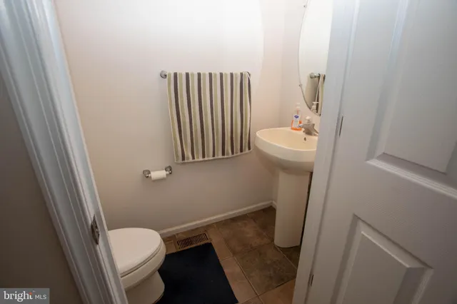 a bedroom with a bed and a mirror