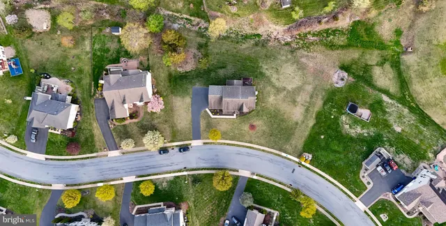 a view of a patio with table and chairs and potted plants