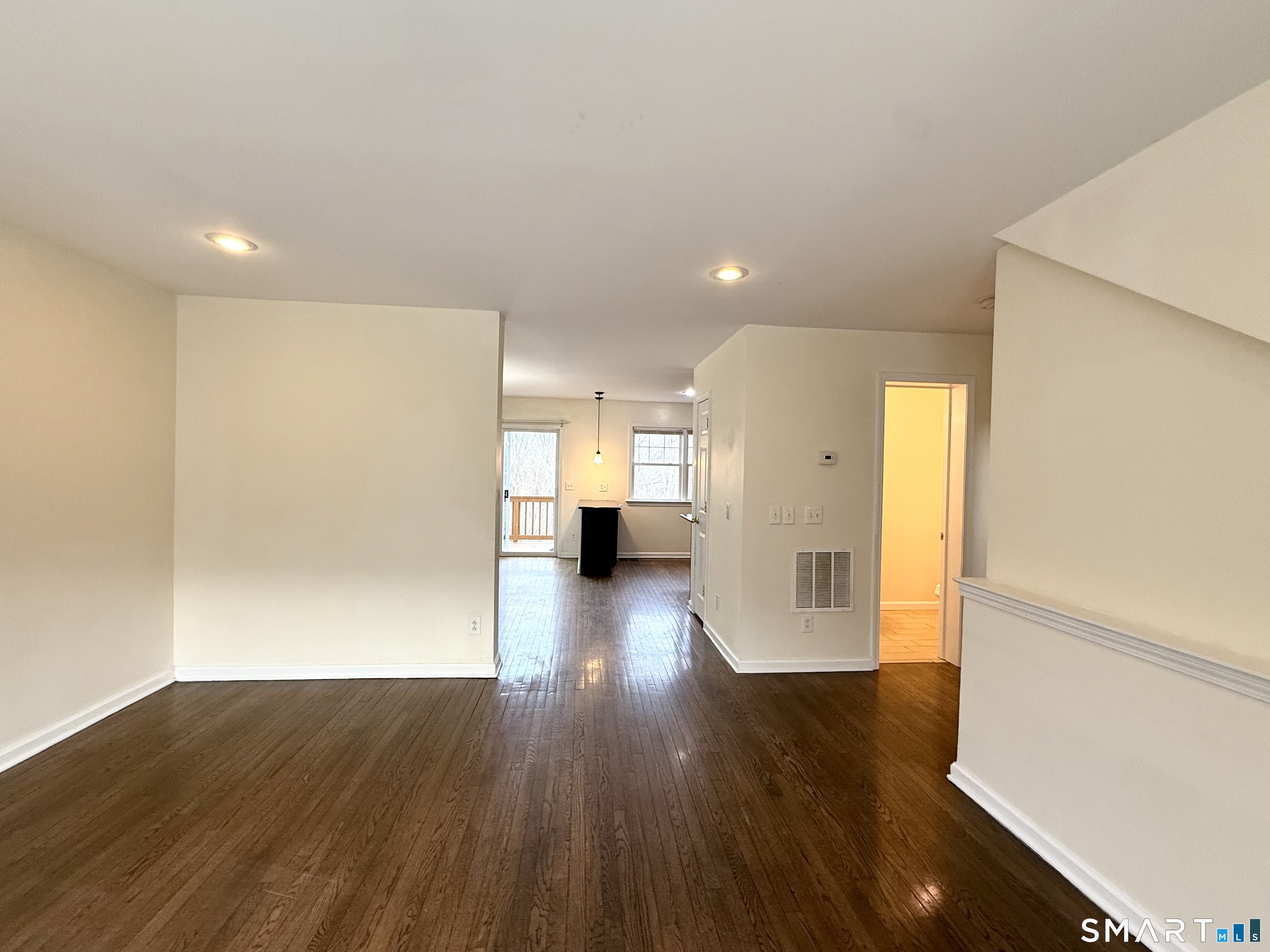 15 Scuppo Road, Unit 603 Danbury, CT 06811 - Photo 6 of 29 a view of empty room with wooden floor