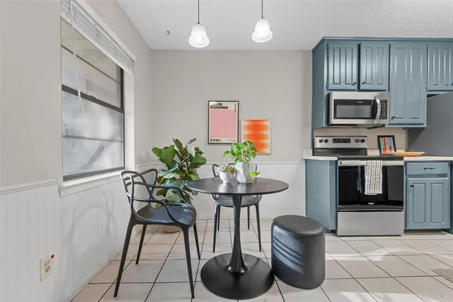 a kitchen with stainless steel appliances a sink and a refrigerator