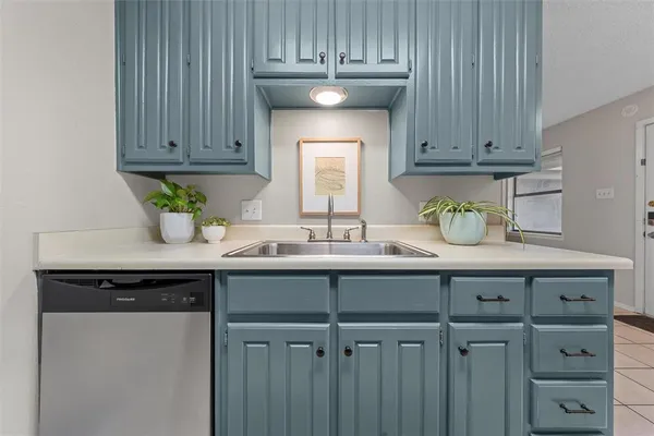 a kitchen with granite countertop cabinets and steel stainless steel appliances