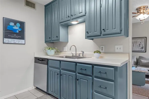 a bedroom with a bed and a potted plant