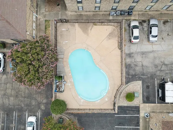 an aerial view of a house with a garden and a fireplace