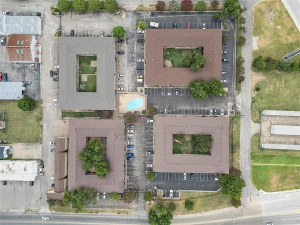 a view of a street with a building in the background