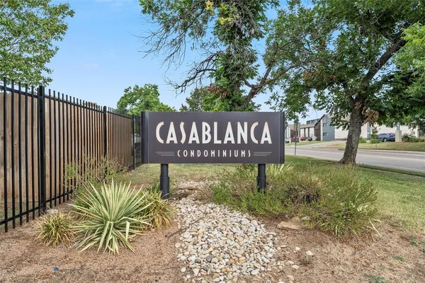 front view of a brick building with a large windows