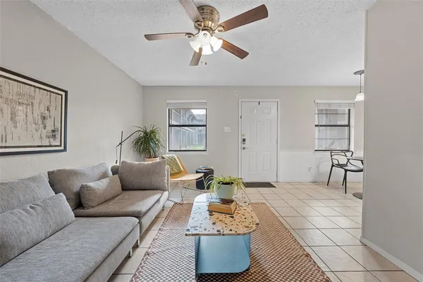 a living room with furniture and a window