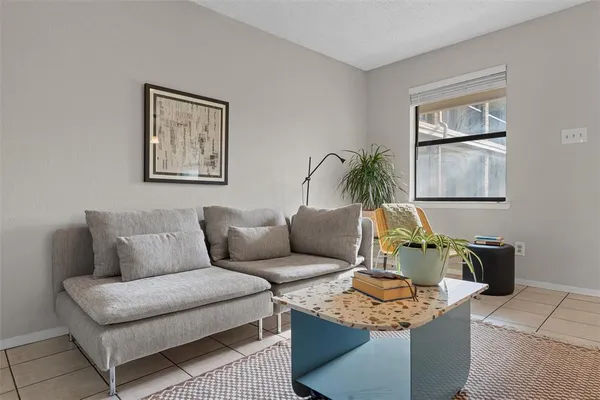 a view of dining room with furniture and a potted plant